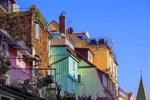 Nested house fronts with cow sculpture