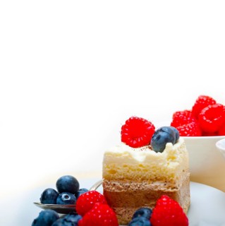 Fresh homemade raspberry and blueberry cream cake