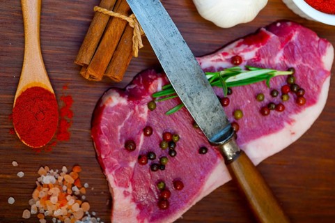 Raw uncooked ribeye beef steak butcher selection
