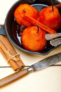 Poached pears delicious home made recipe ove white rustic wood table