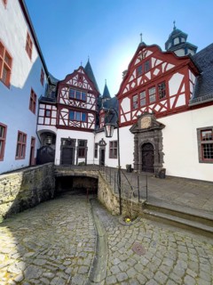 View from castle courtyard to buildings of Trier castle in double castle Buerresheim from the Middle Ages