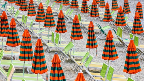 Sunbeds and umbrellas at the beach di Fegina in Monterosso al Mare