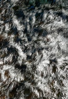 Flowing water with light reflections