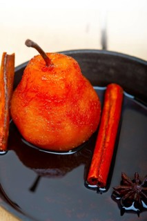 Poached pears delicious home made recipe ove white rustic wood table