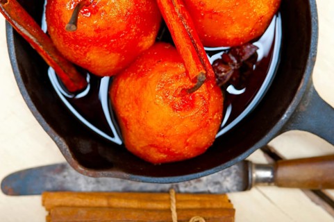 Poached pears delicious home made recipe ove white rustic wood table