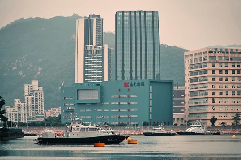Ships and buildings in the sea in Macau