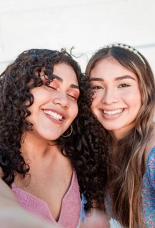 Close up of two cute girls taking a selfie