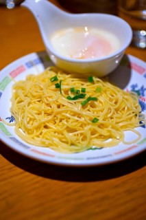 Traditional Japanese ramen noodles with poached egg on the side