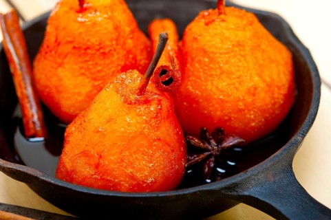 Poached pears delicious home made recipe ove white rustic wood table