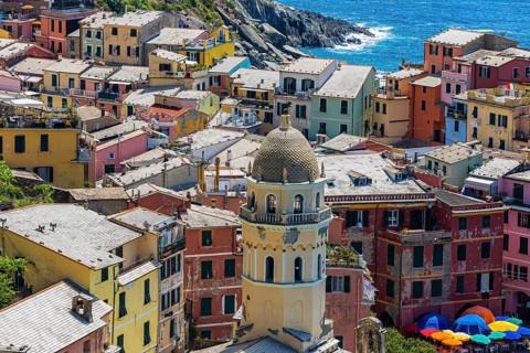 The village of Vernazza with its nested pastel-coloured houses built into the hillside
