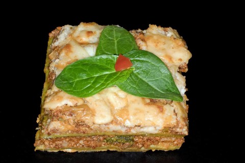 Classic lasagne with spinach leaves