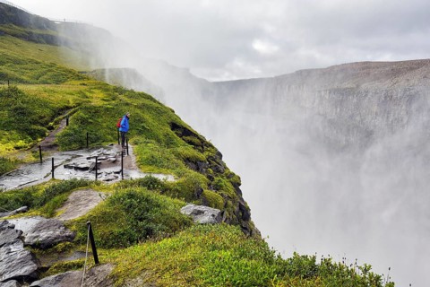 Hiker at the edge of Dettifoss
