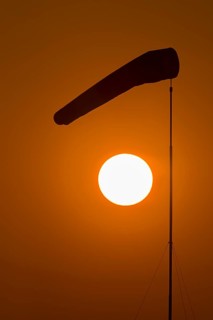 Evening sun with windsock