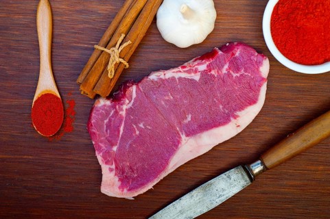Raw uncooked ribeye beef steak butcher selection