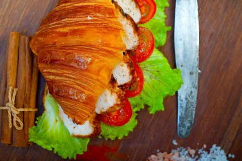 Savory croissant brioche bread with chicken breast and vegetable rustic style