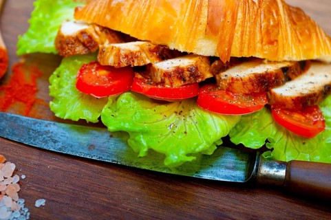 Savory croissant brioche bread with chicken breast and vegetable rustic style