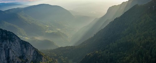 Morning atmosphere over the Val de Travers from the edge of the rocky basin at the Creux du Van