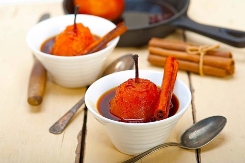 Poached pears delicious home made recipe ove white rustic wood table