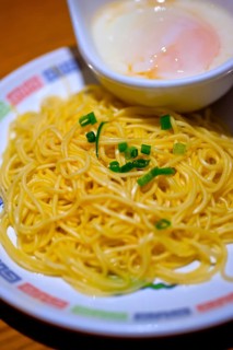 Traditional Japanese ramen noodles with poached egg on the side