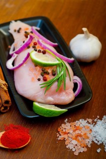 Fresh organic chicken breast with herbs and spices