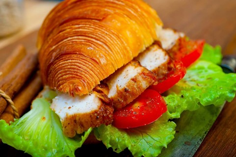 Savory croissant brioche bread with chicken breast and vegetable rustic style