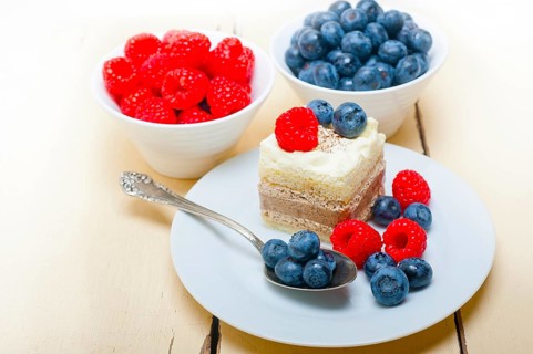 Fresh homemade raspberry and blueberry cream cake