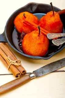 Poached pears delicious home made recipe ove white rustic wood table