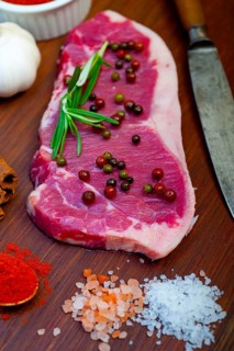 Raw uncooked ribeye beef steak butcher selection