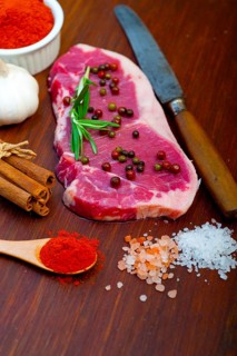 Raw uncooked ribeye beef steak butcher selection