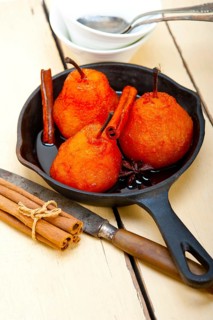 Poached pears delicious home made recipe ove white rustic wood table