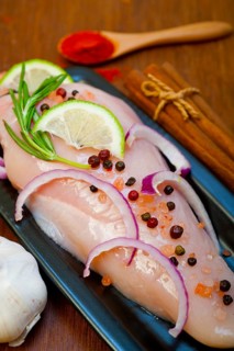 Fresh organic chicken breast with herbs and spices