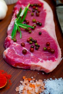 Raw uncooked ribeye beef steak butcher selection