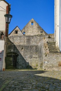 View from castle courtyard of Trier castle to ruin of Cologne castle in double castle Buerresheim from Middle Ages