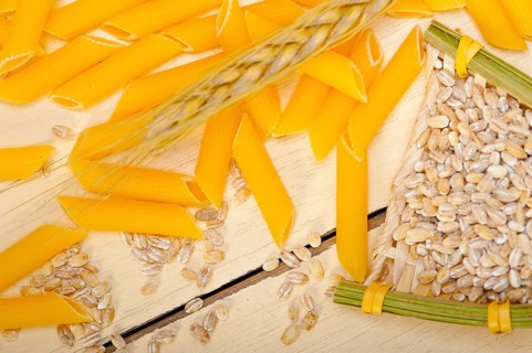 Short Italian pasta penne with durum wheat grains