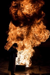 Firefighter extinguishes a heptane 2B-Pan fire with a 2-BTP extinguisher