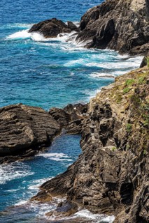 Steep cliffs washed by water on the Ligurian coast off Vernazza