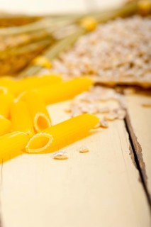 Short Italian pasta penne with durum wheat grains
