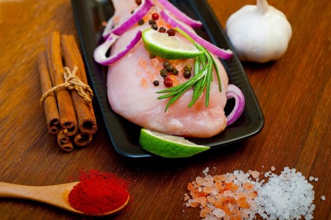 Fresh organic chicken breast with herbs and spices
