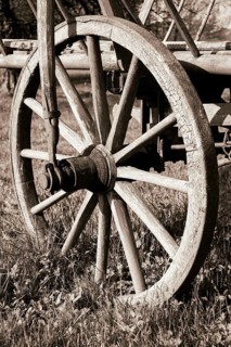Wooden wheel on an old wooden cart