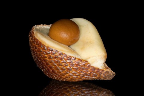 Halved snake fruit with pit