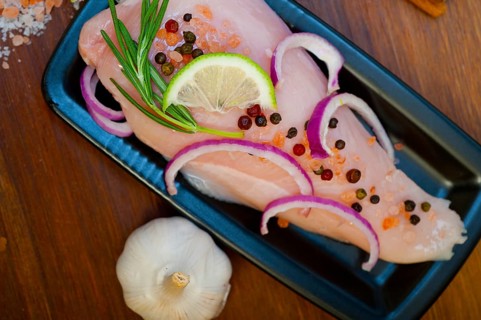 Fresh organic chicken breast with herbs and spices