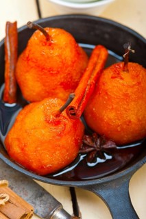 Poached pears delicious home made recipe ove white rustic wood table