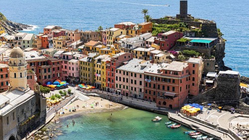 The village of Vernazza with its nested pastel-coloured houses built into the hillside