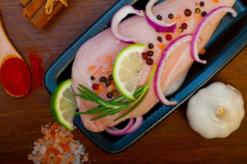 Fresh organic chicken breast with herbs and spices