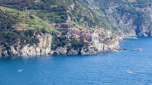 The village of Manarola with its nested pastel-coloured houses built into the hillside