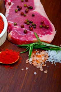 Raw uncooked ribeye beef steak butcher selection
