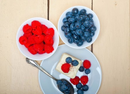 Fresh homemade raspberry and blueberry cream cake