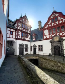 View from castle courtyard to buildings of Trier Castle in double castle Buerresheim from Middle Ages