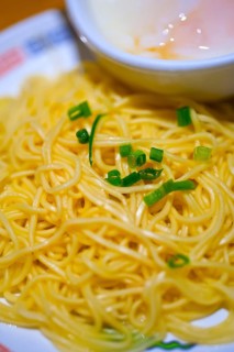 Traditional Japanese ramen noodles with poached egg on the side