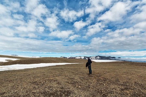 Tourist on stony plateau